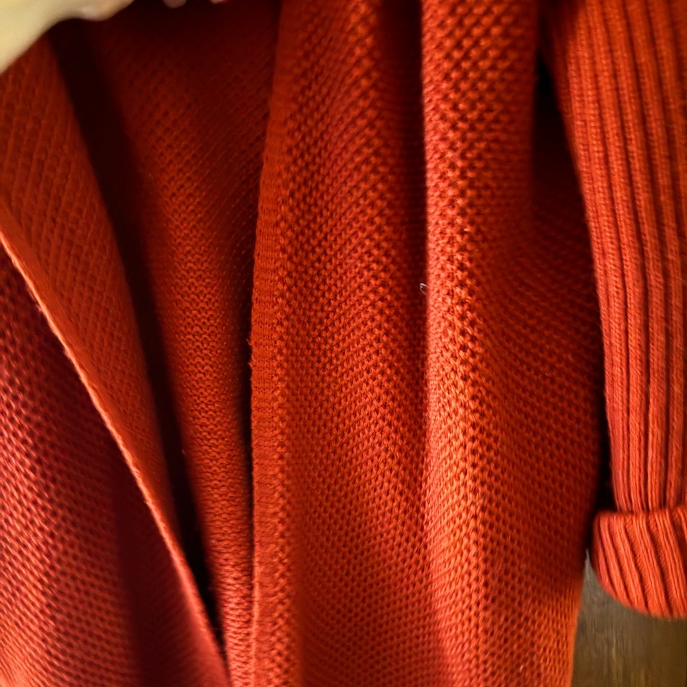 Open front cardigan sweater. Burnt orange color.